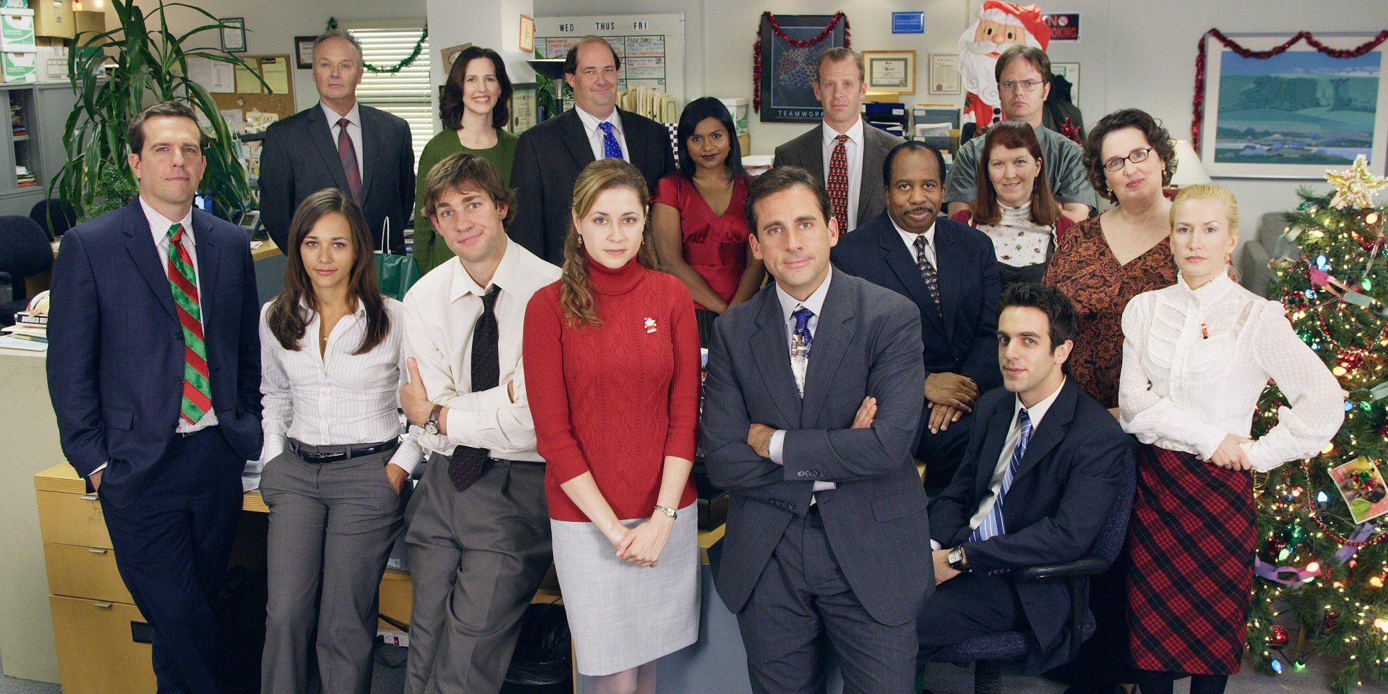 Michael Scott standing with The Office employees