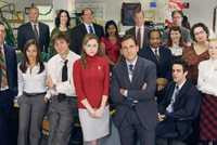 Michael Scott standing with The Office employees