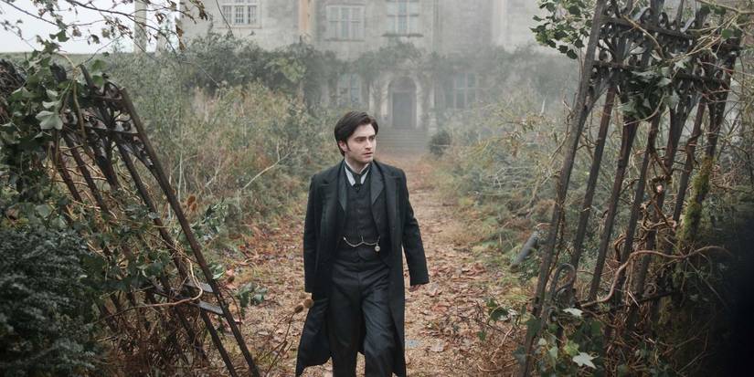 Arthur Kipps walking through a dilapidated garden in The Woman in Black.