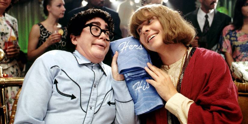 Julia Sweeney and Dave Foley in It's Pat, looking lovingly at each other