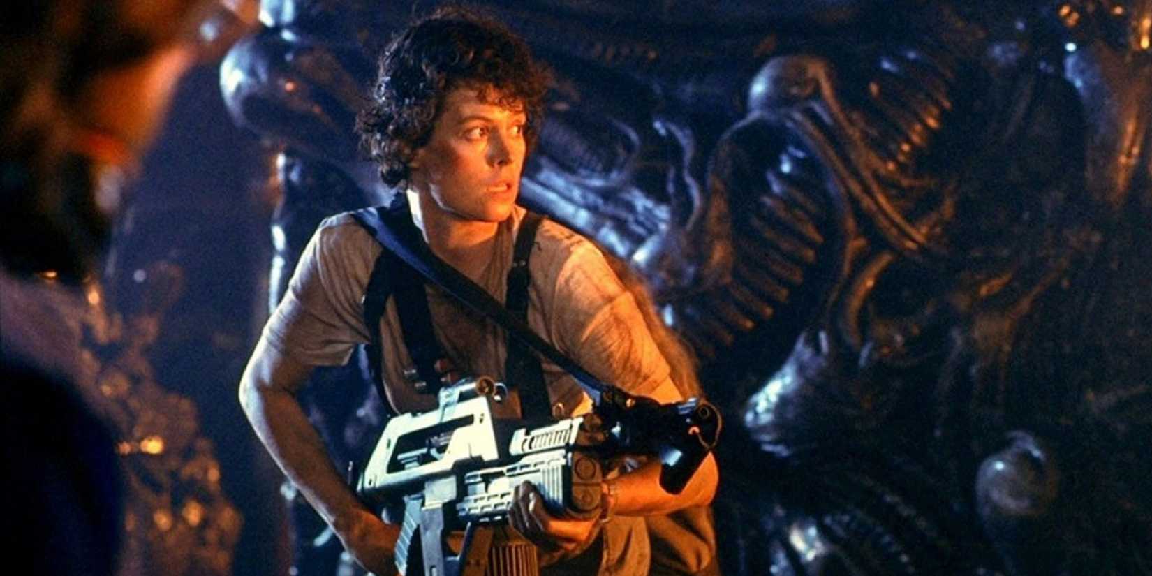 Ellen Ripley holding a weapon in Aliens.