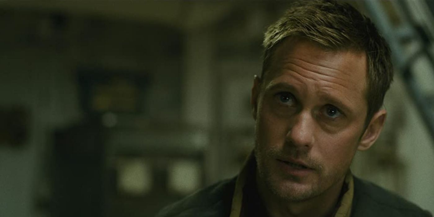 Alexander Skarsgard as Dr. Nathan Lind looking concerned in Godzilla vs. Kong