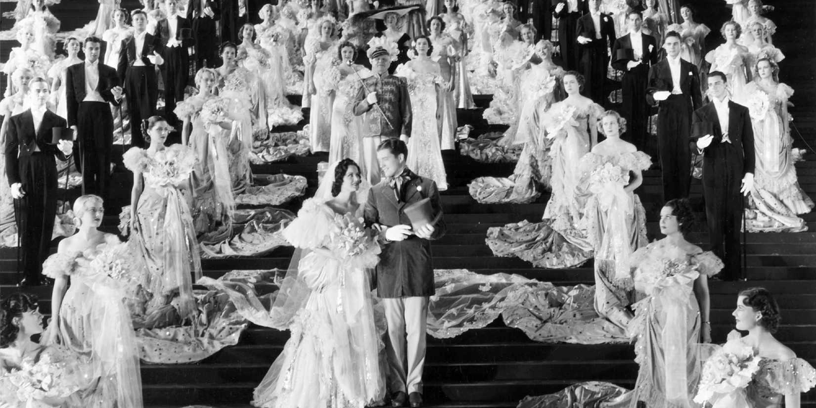 A couple marching surrounded by people in The Great Ziegfeld
