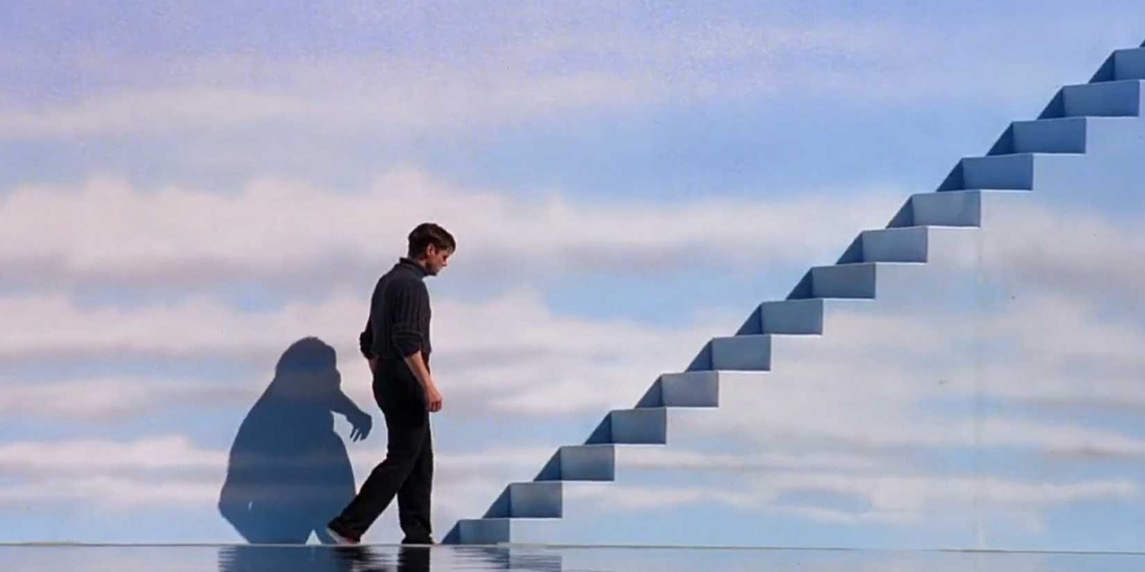 Truman about to walk up a set of stairs in The Truman Show