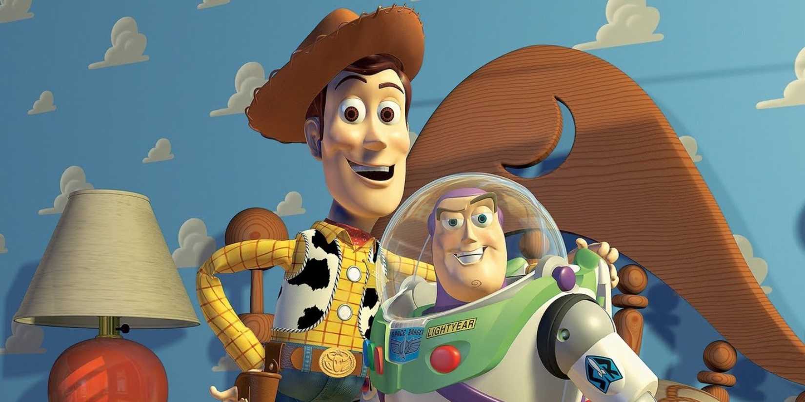 Woody and Buzz Lightyear smiling towards the camera in Toy Story