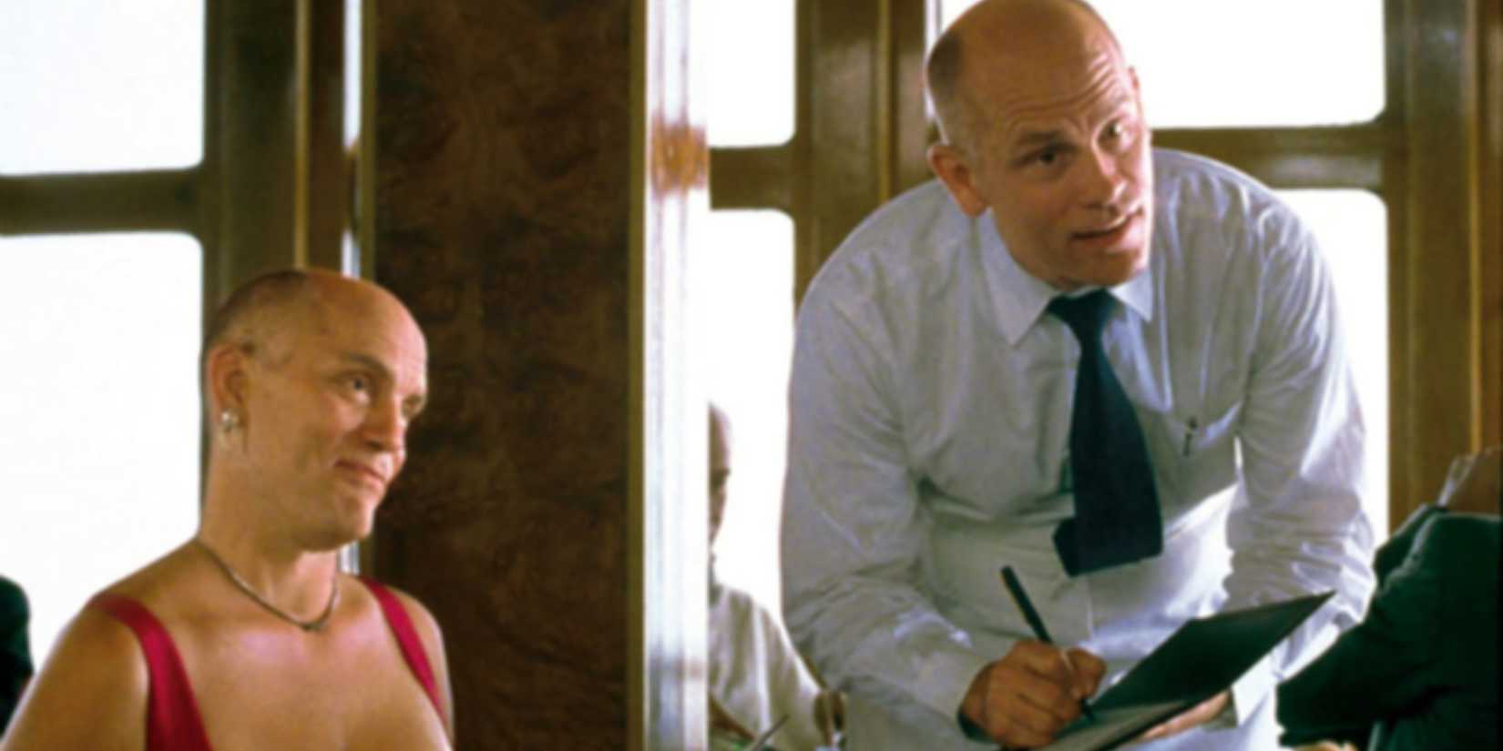 John Malkovich as a waiter and a seductive young woman at a restaurant in Being John Malkovich