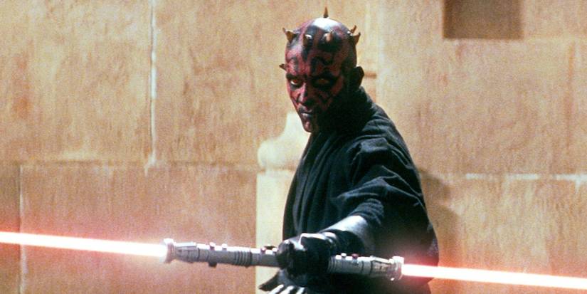 Darth Maul holding his double lightsaber, ready to fight, in The Phantom Menace