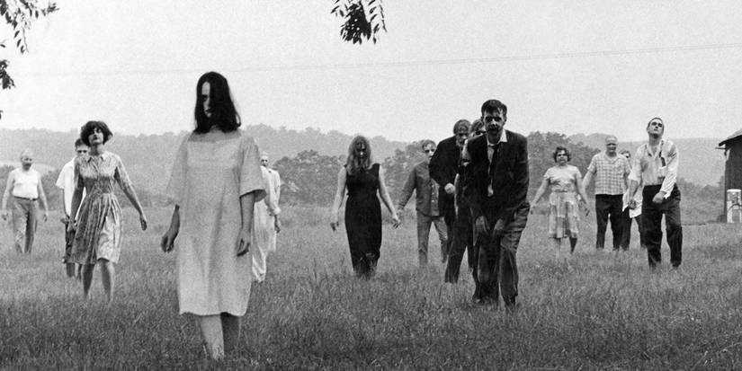 A group of zombies walking through a field in Night of the Living Dead