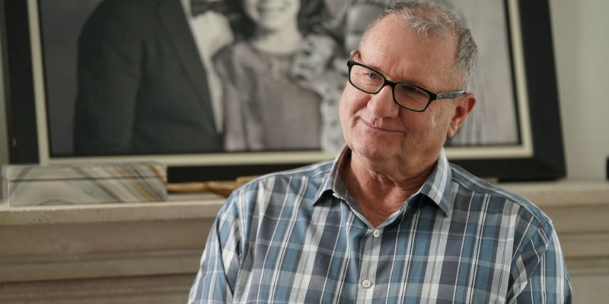 Jay Pritchett (Ed O'Neill) smiling warmly in Modern Family