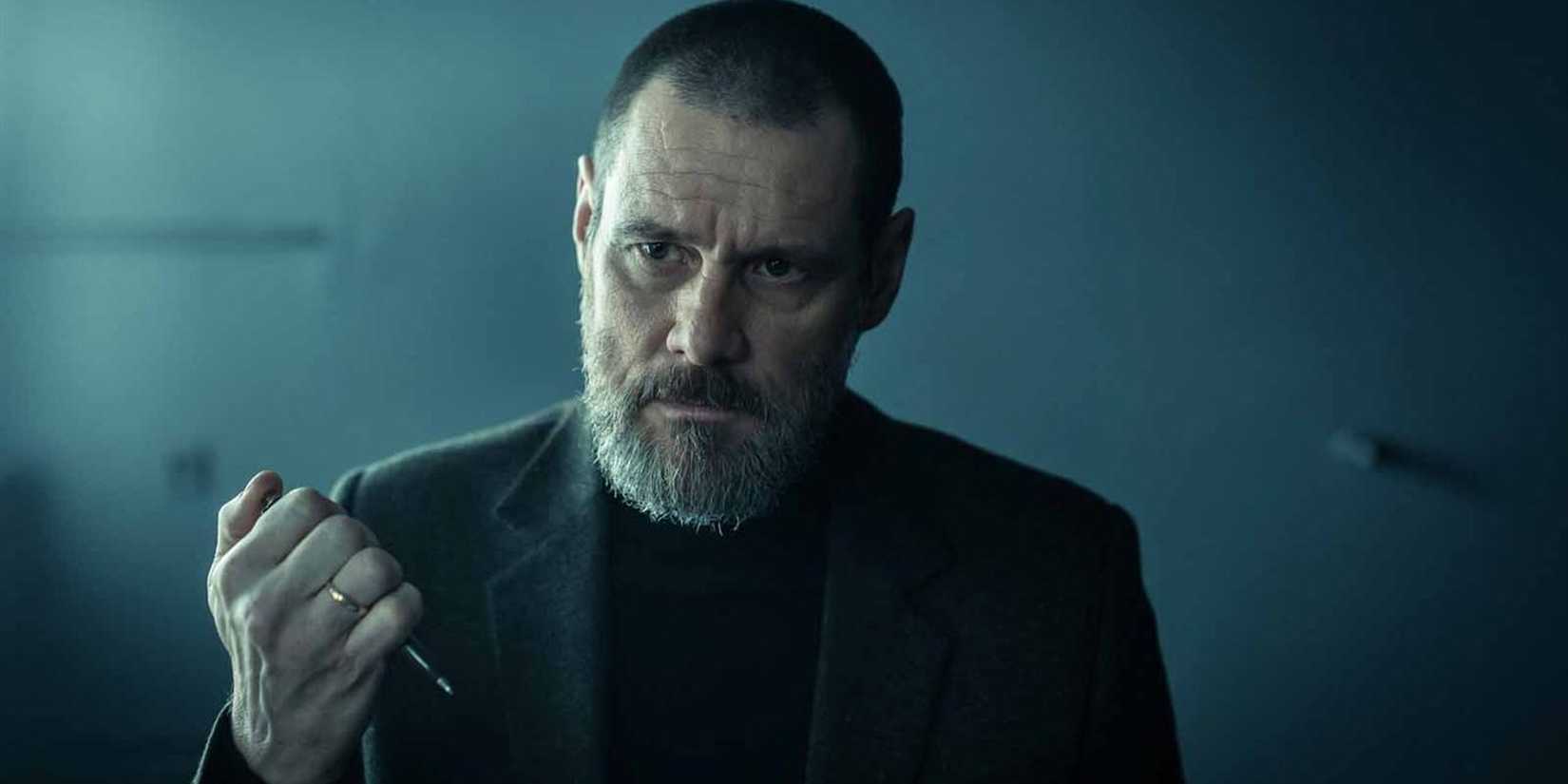 Jim Carrey as Detective Tadek clicks his pen on, ready to take notes, and looks stern