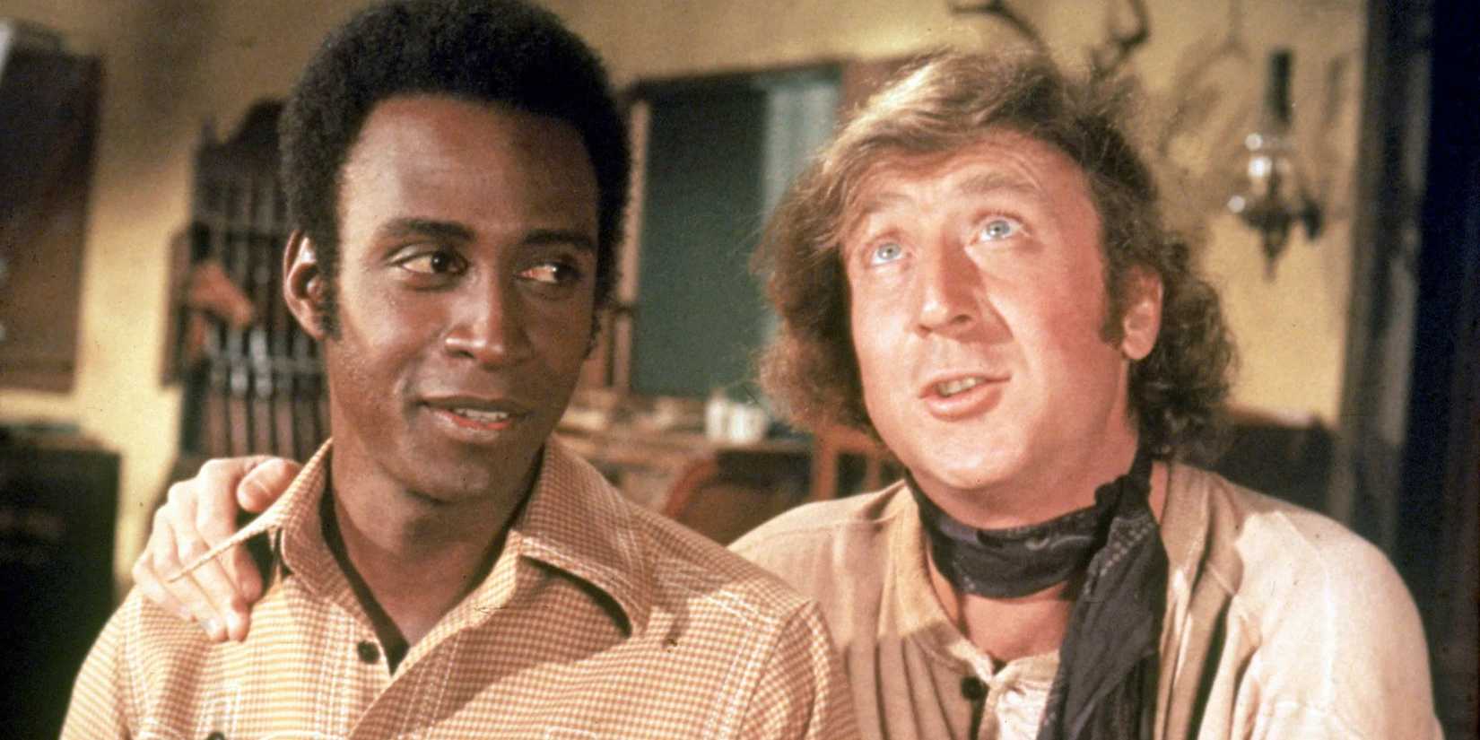 Cleavon Little as Bart & Gene Wilder as Jim the Waco Kid looking up at an object offscreen in Blazing Saddles