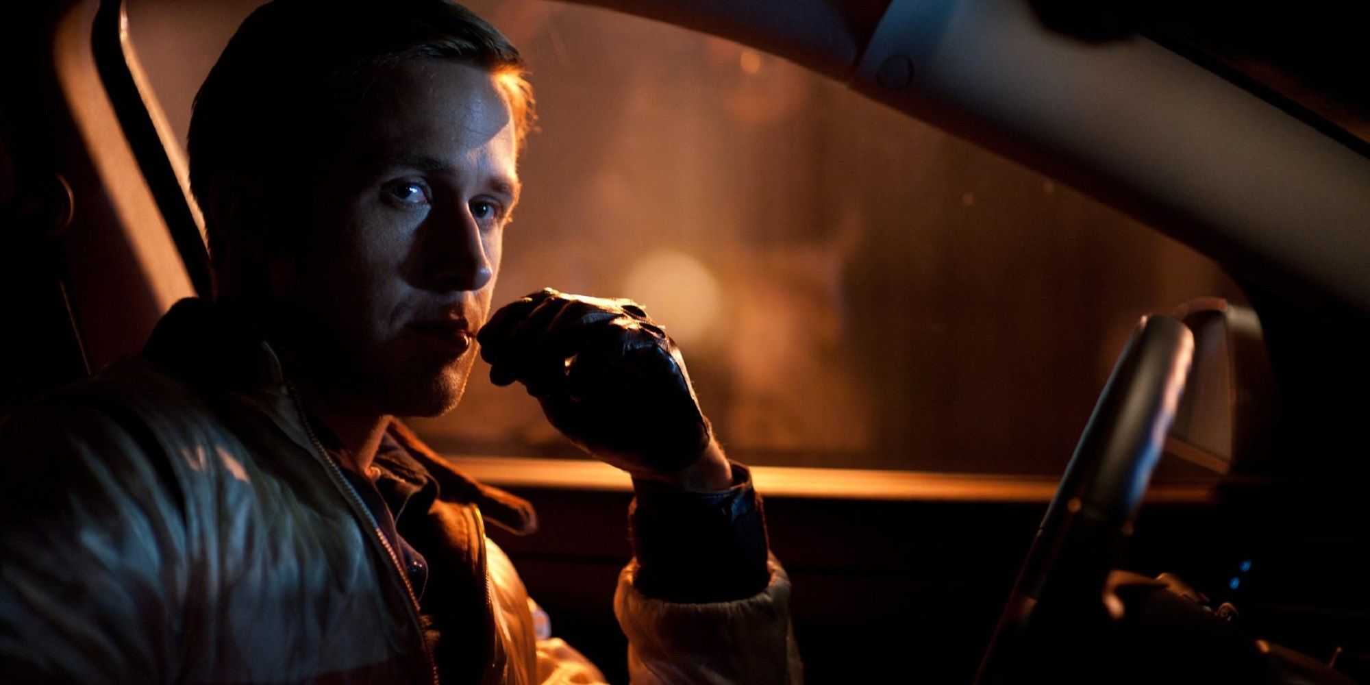 The Driver in a car, moonlighting as a getaway driver in Drive.