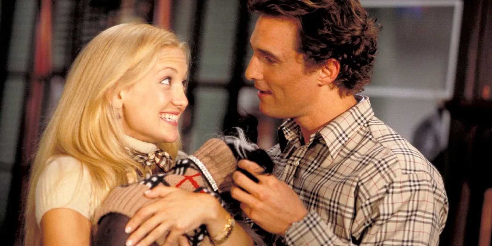 Kate Hudson and Matthew McConaughey holding a dog in matching outfits in How to Lose a Guy in 10 Days.