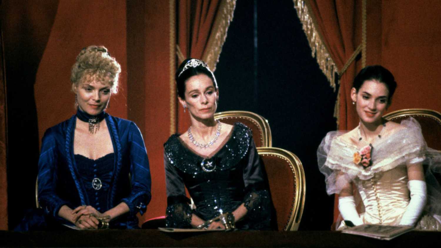 Three women sitting next to each other in The Age of Innocence.