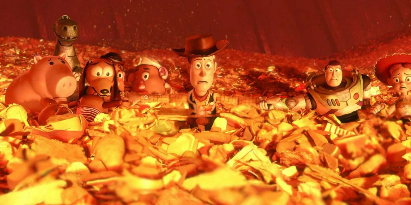 Woody (Tom Hanks), Buzz (Tim Allen) and other toys in a pile of trash about to be incinerated in Toy Story 3.