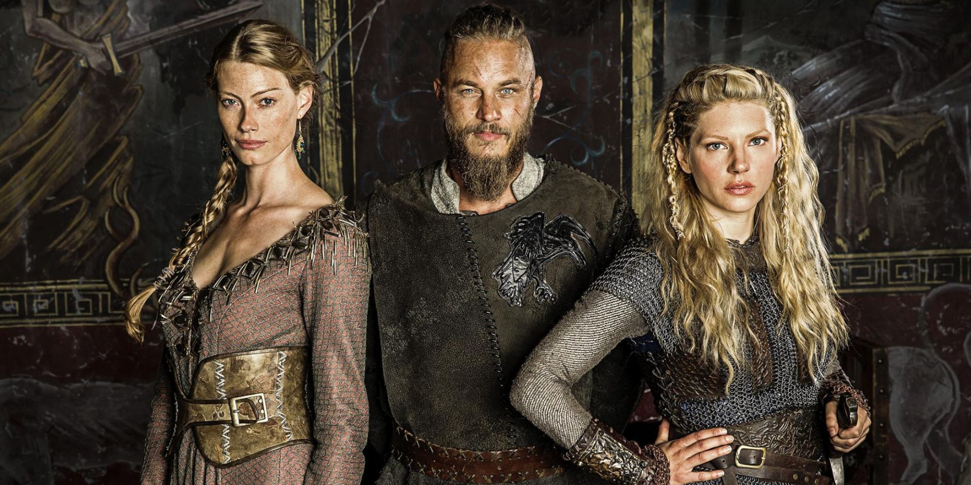 Ragnar with Aslaug and Lagertha pose toward the camera in Vikings