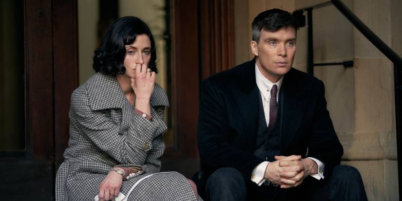 Cillian Murphy as Tommy Shelby and Natasha O'Keeffe as Lizzie Stark sitting on the hospital stairs in Peaky Blinders Season 6