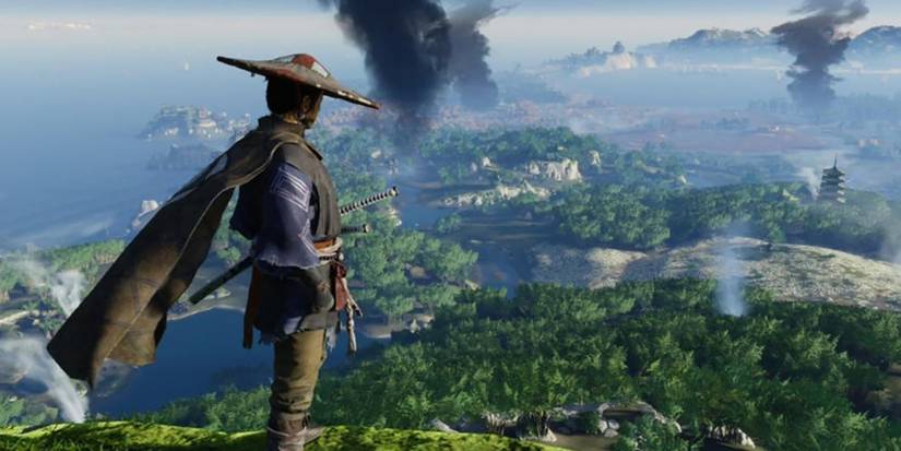 A samurai looking down at an island with smoke coming out of different places in Ghots of Tsushima