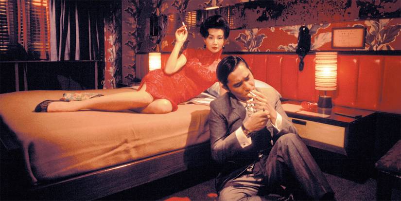 Maggie Chung as Su Li-zhen waltching Tony Liu as Mo-wan lighting a cigarrette in In the Mood for Love