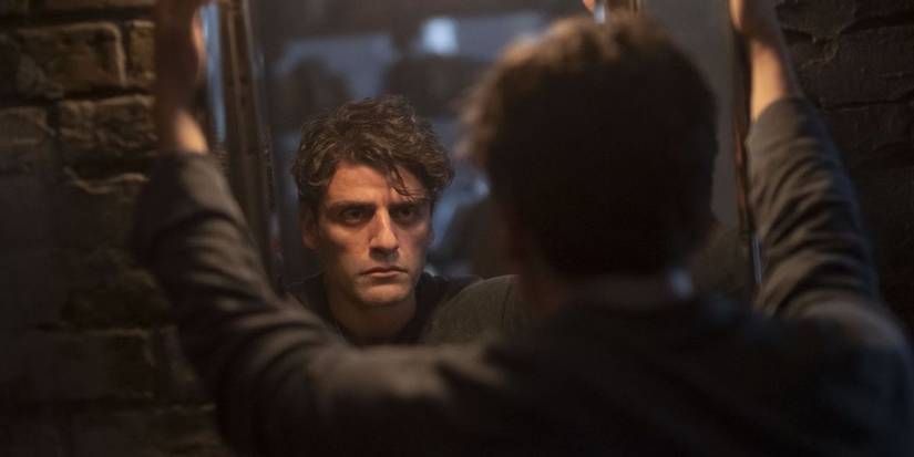 Mark Spector looking in the mirror in Moon Knight