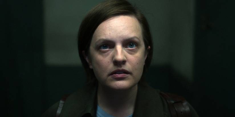 Elisabeth Moss looking up with a solemn expression in Shining Girls.