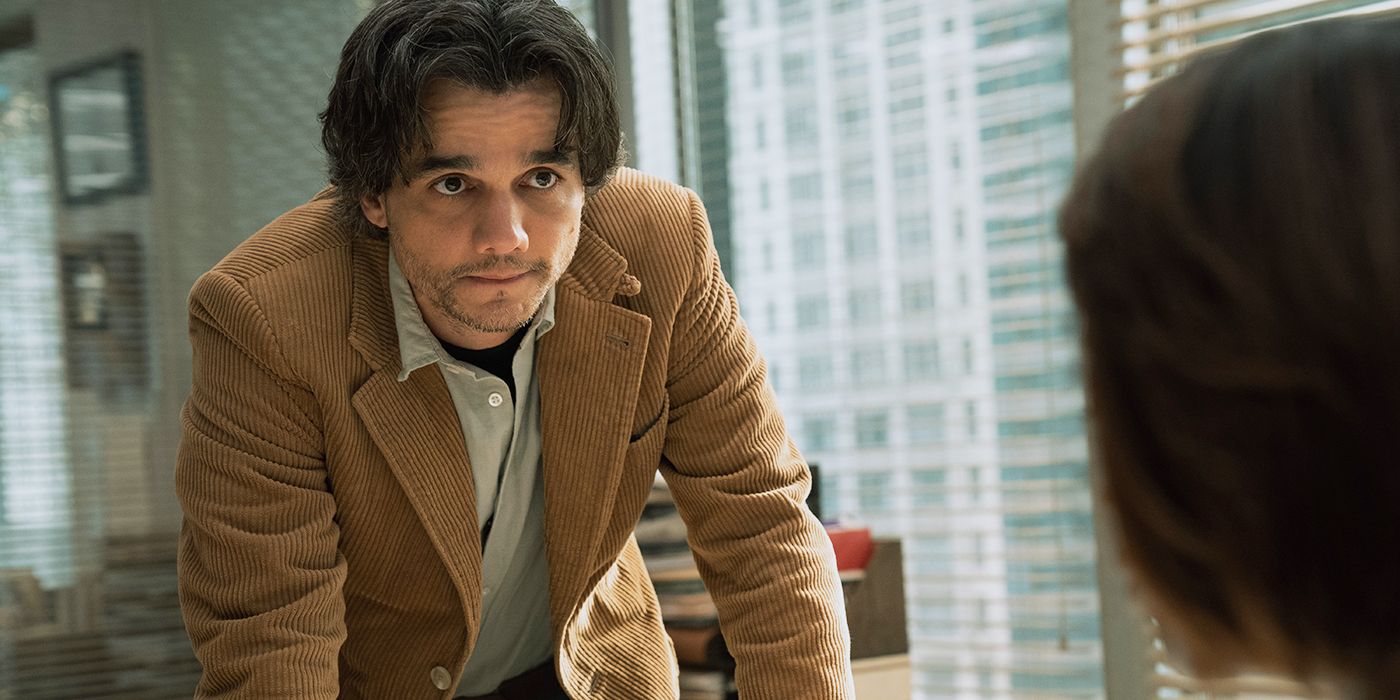 Wagner Moura as Dan Velasquez leaning on a desk in 'Shining Girls'
