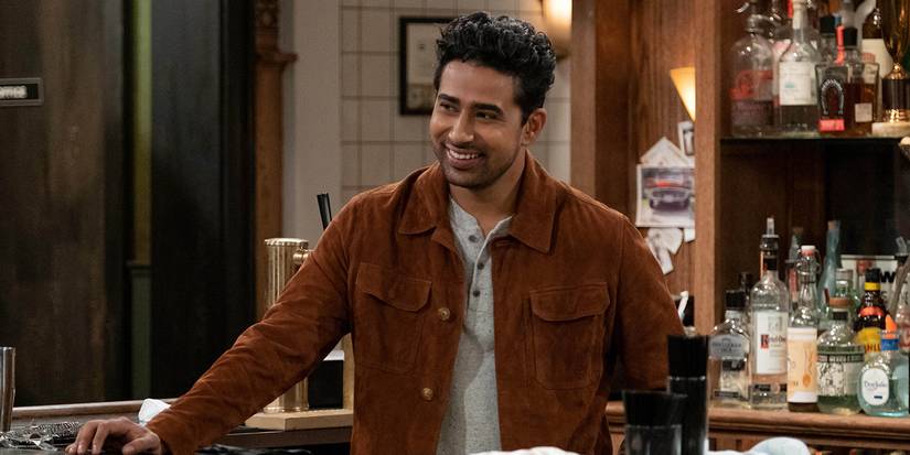 Sid standing behind the bar in How I Met Your Father.