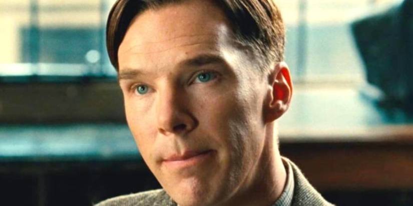 Benedict Cumberbatch smiling up at someone slightly in The Imitation Game