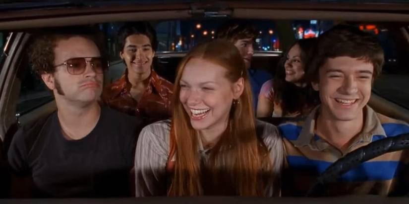 The kids from That '70s Show smiling in the car from the opening sequence