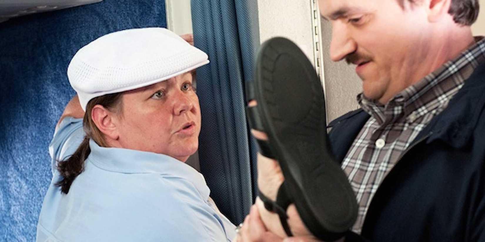 Megan raising her leg to stop a man from passing in Bridesmaids.