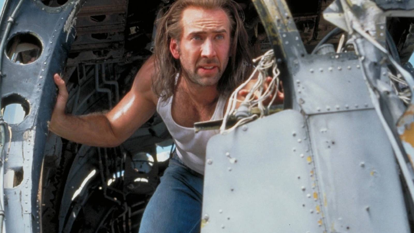 Nicolas Cage leans out a dilapidated airplane in Con Air