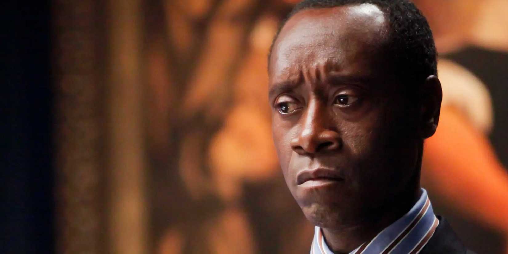 Don Cheadle as Paul Rusesabagina looking pensive in Hotel Rwanda