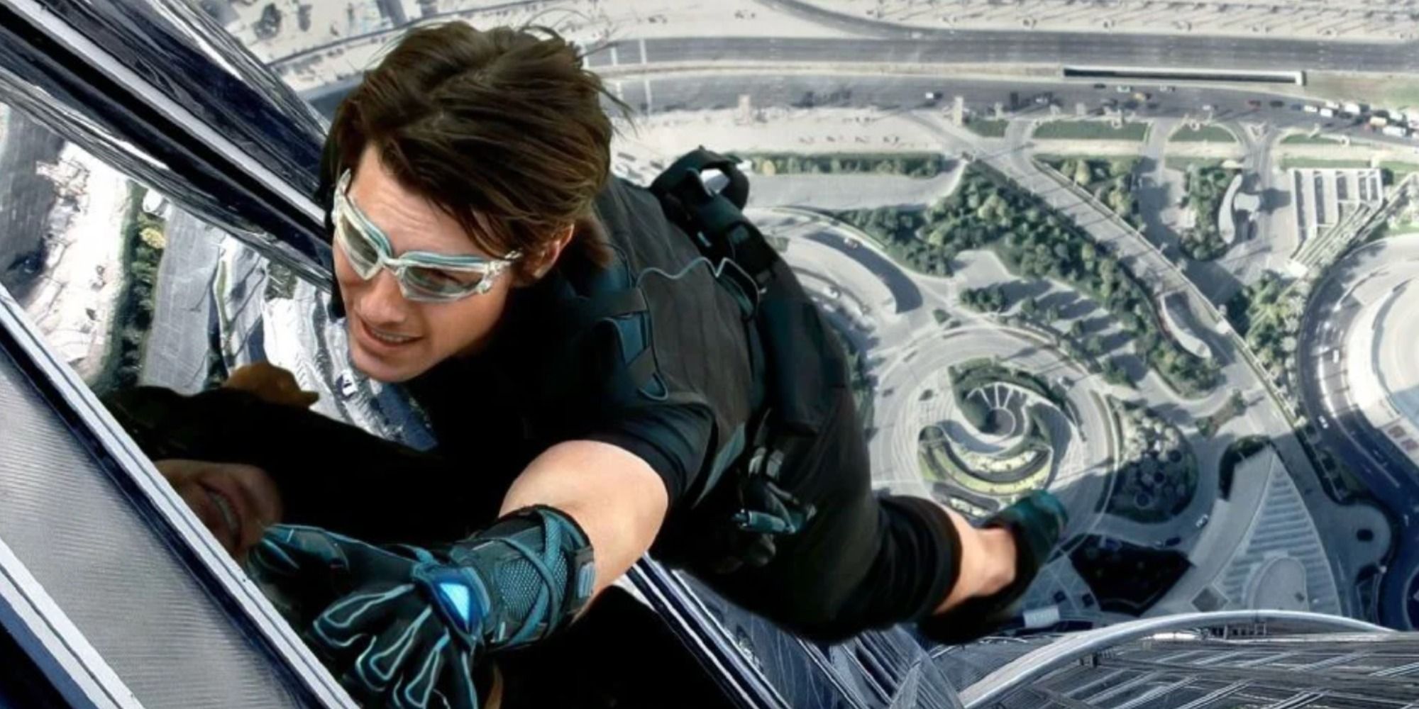 Ethan Hunt scaling the side of a building 