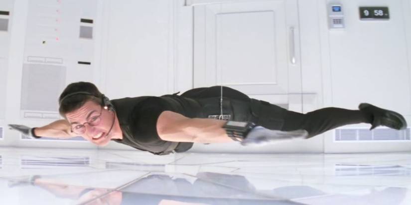 Ethan Hunt hanging from a cord in Mission: Impossible.