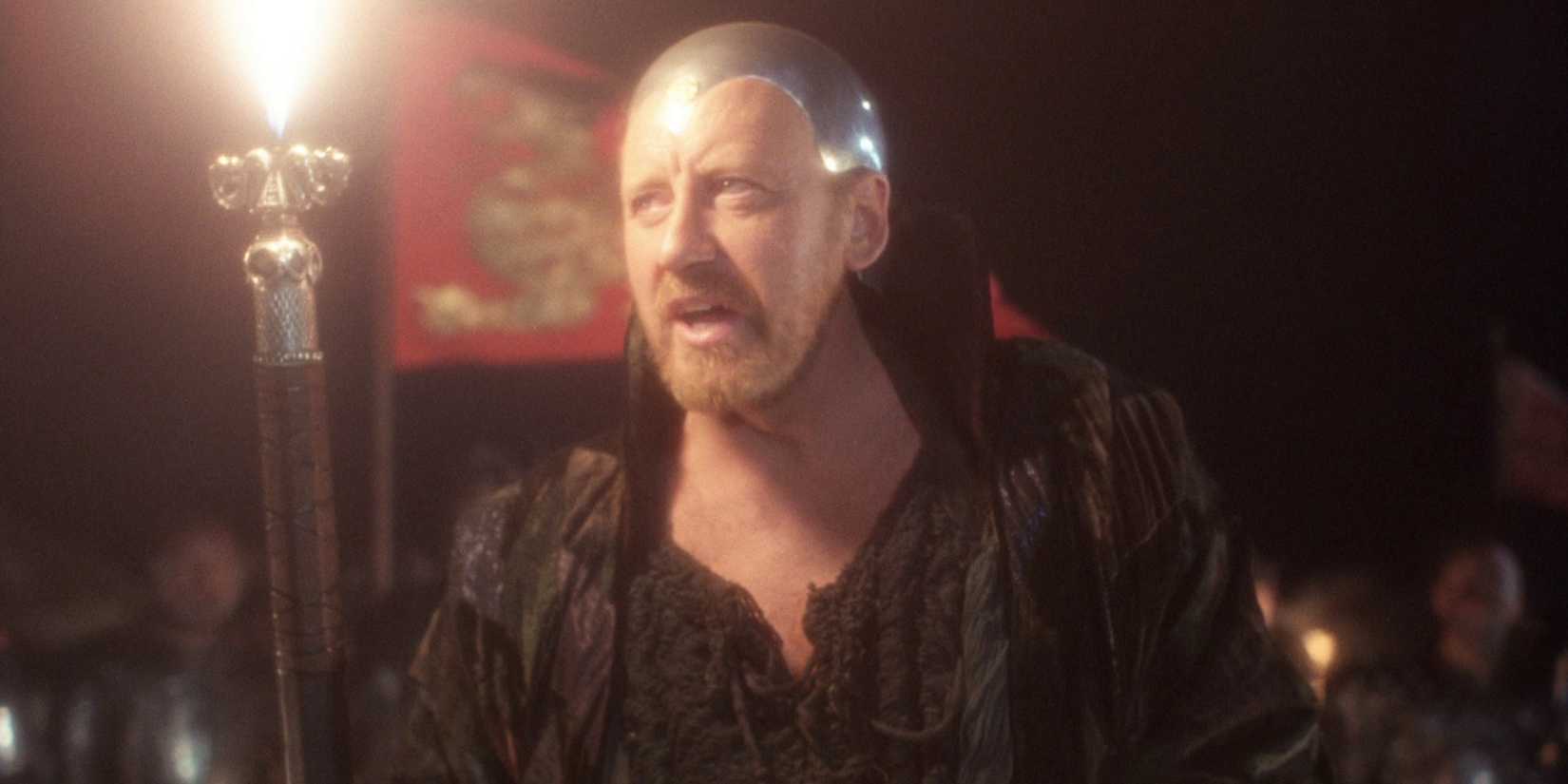 Nicol Williamson as Merlin holding a torch in 'Excalibur' (1981)