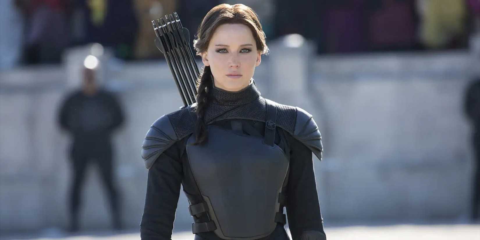 Katniss Everdeen standing firm in the arena in The Hunger Games: Mockingjay Part 2