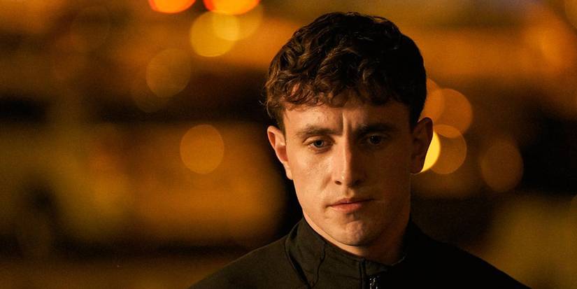 Paul Mescal looking somber against a dark background in Normal People 