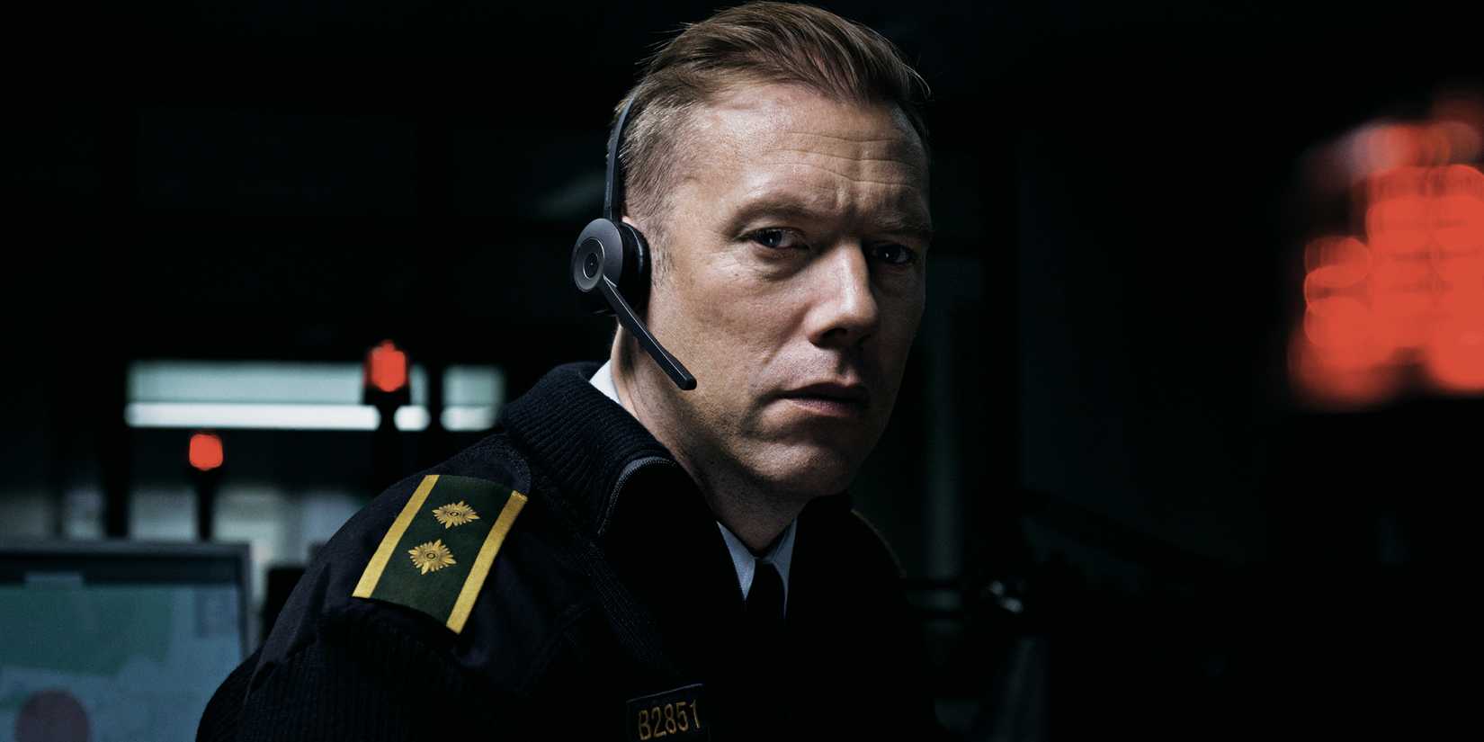 Jakob Cedergren as Asger looking at the camera worried in The Guilty 2018 