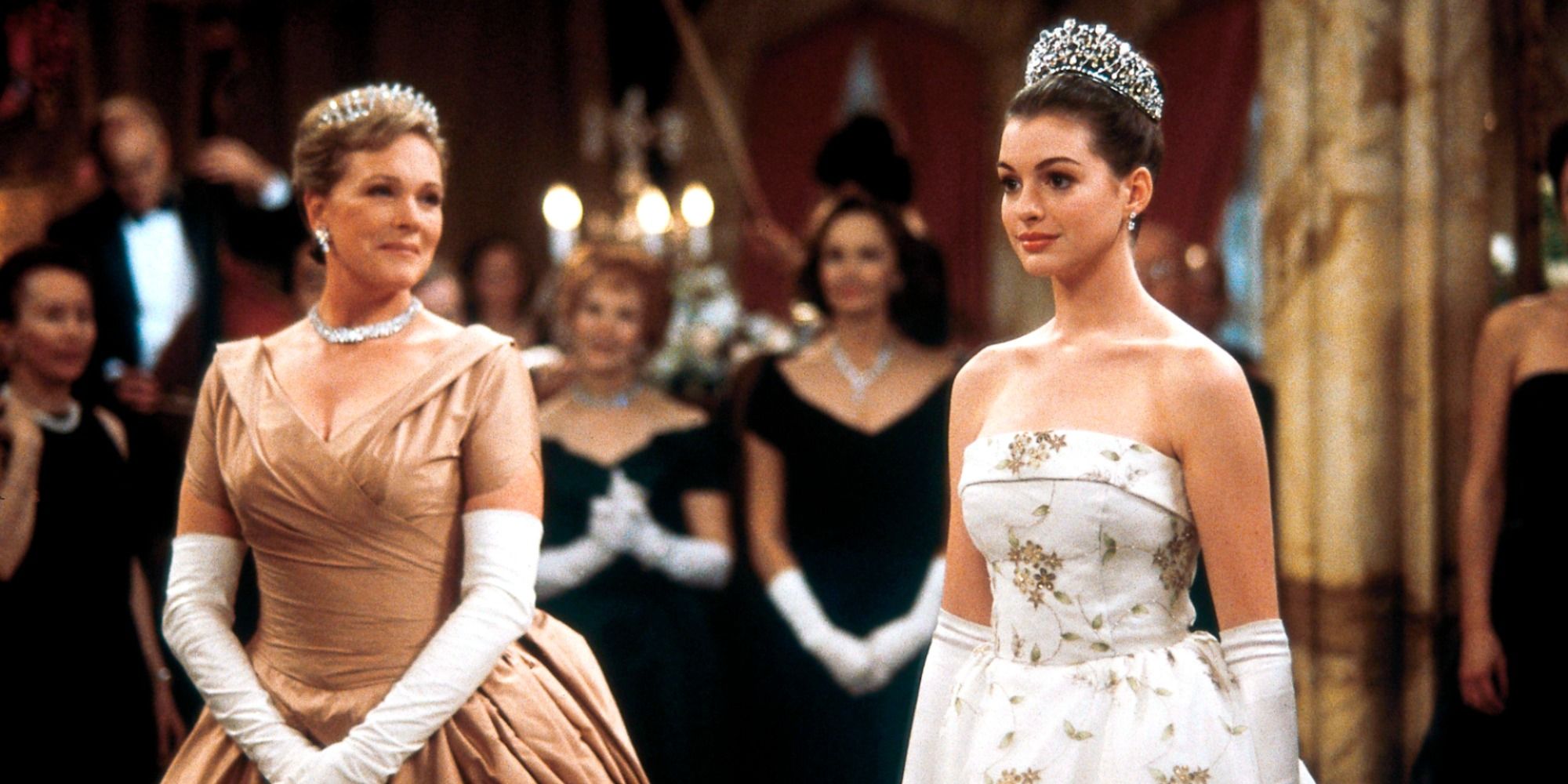 Julie Andrews and Anne Hathaway in ballgowns during a royal ceremony