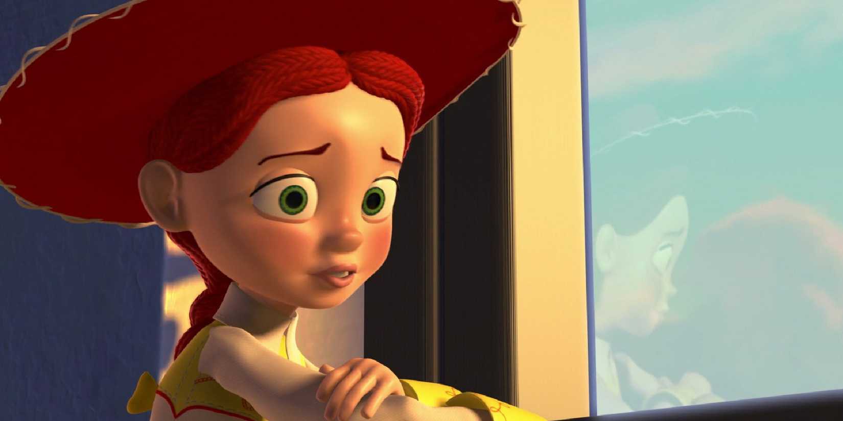 Jessie the cowgirl (voiced by Joan Cusack), sitting sadly by a window in Toy Story 2