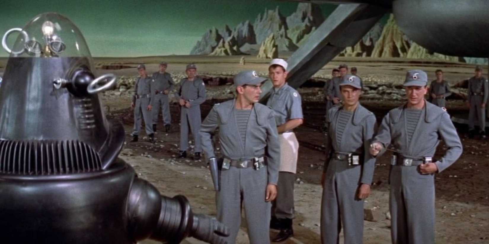 Robot and crew on a planet in Forbidden Planet, 1956.
