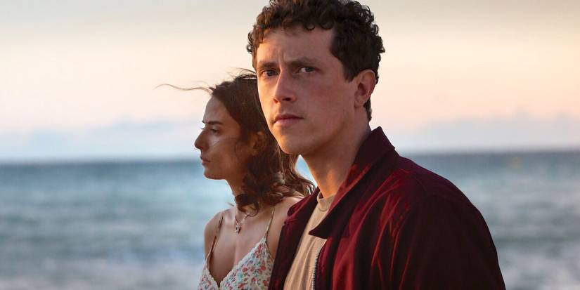 Finnegan Oldfield in Netflix's 'Gone for Good' looking straight ahead and positioned in front of a woman. 