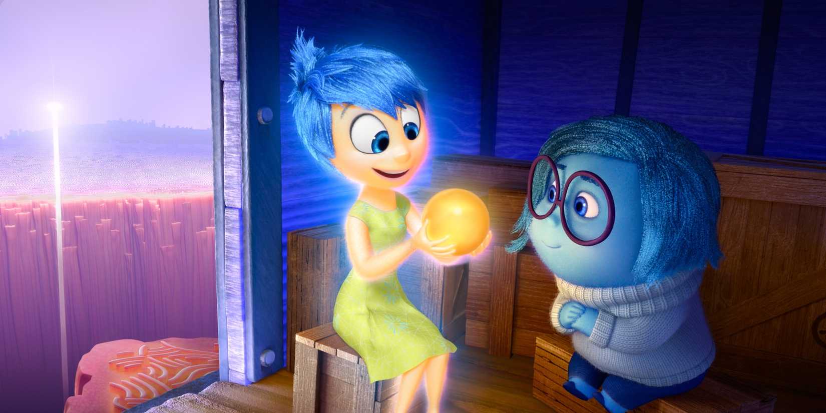 Joy and Sadness looking at a core memory in 'Inside Out'.