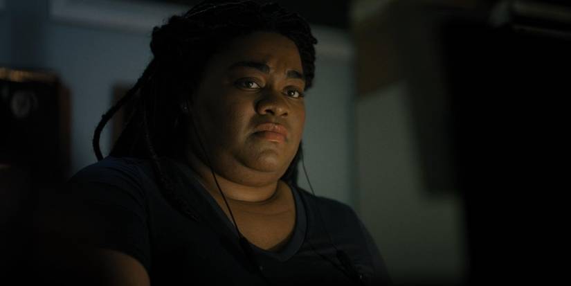 Da'Vine Joy Randolph as Detective Wiliams listening with headpones in Only Murders in the Building.