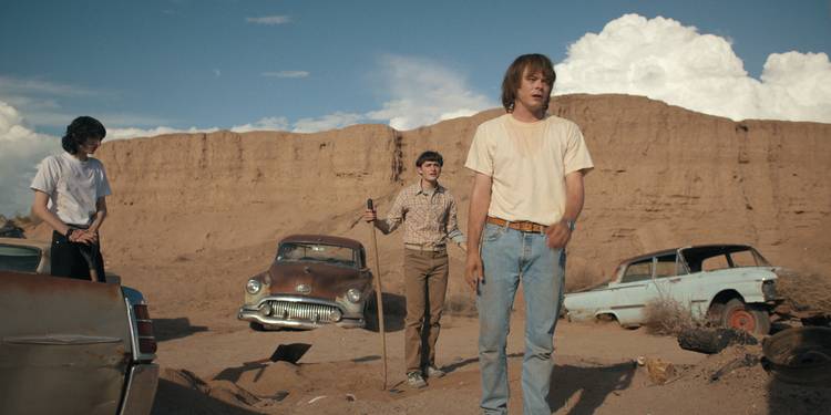 Mike, Will, and Jonathan in the desert in Stranger Things Season 4