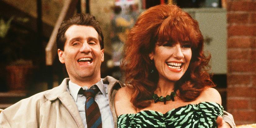 Al (Ed O’Neill) and Peggy (Katey Sagal) laughing together in Married With Children.