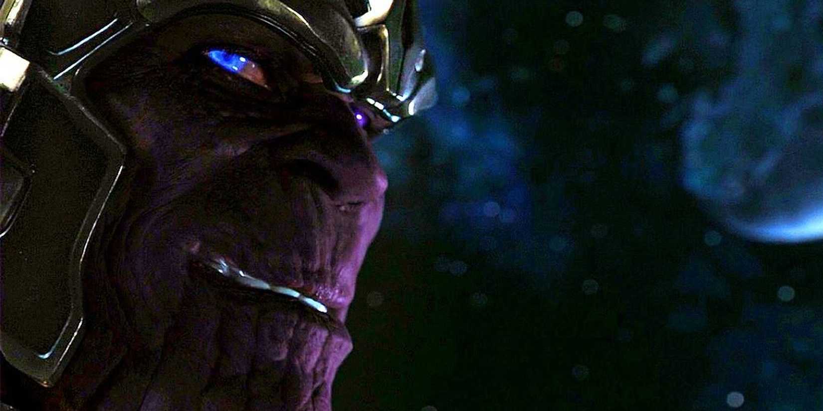 Thanos looks to the side at the camera with blue glowing eyes in The Avengers 2012 end credits scene.