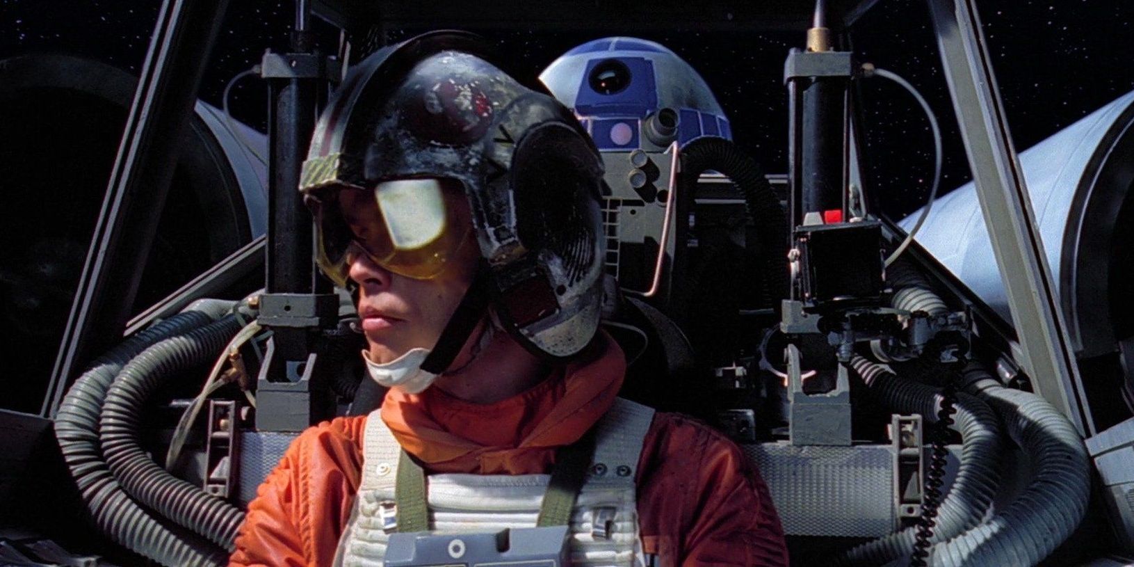 Luke Skywalker of 'Star Wars' sits in the cockpit of his X-Wing. R2D2 sits behind him.
