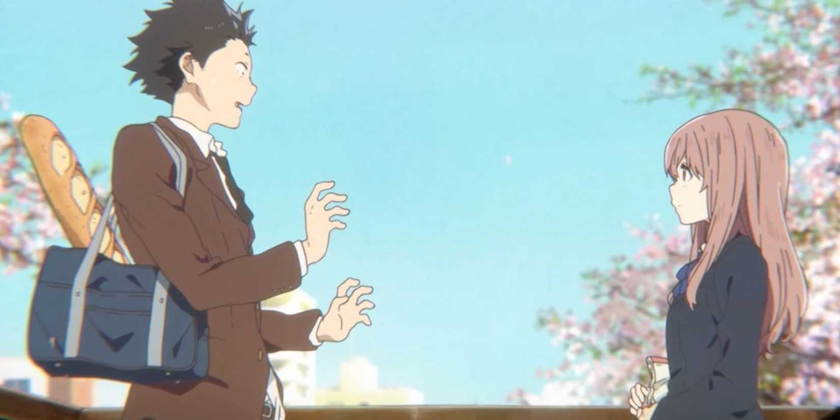 Shoya and Shoko talk to each other at a distance with pink flowering trees in the background in A Silent Voice