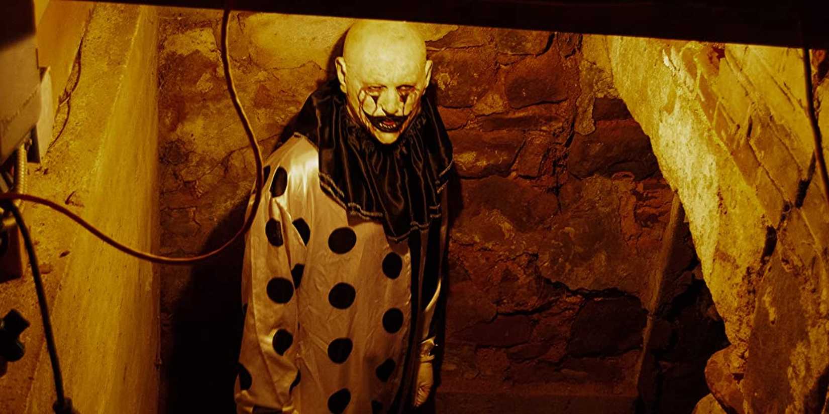 A Clown looking up at the camera in Hell House LLC